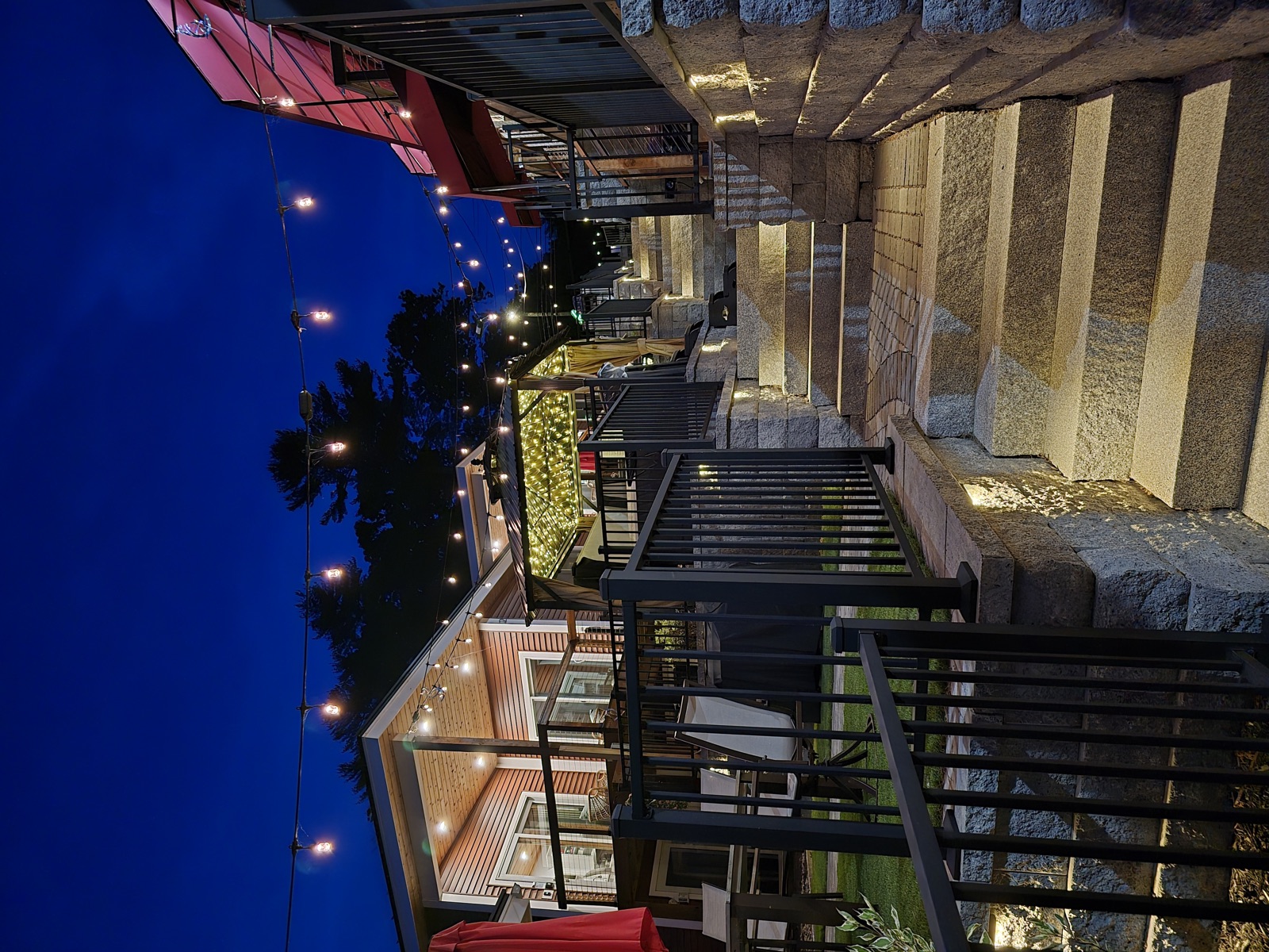 Lit pathway through the resort at night
